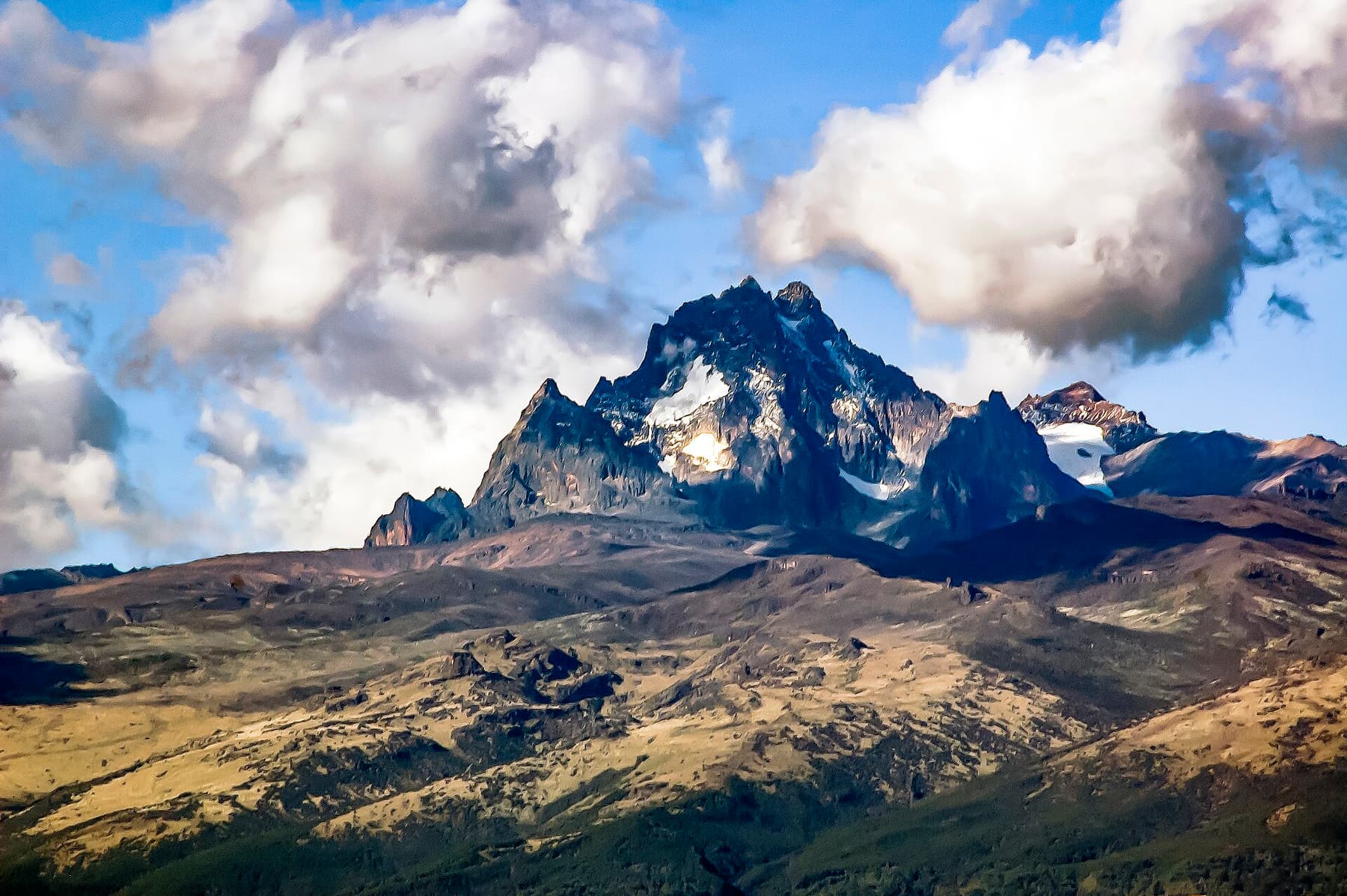 The jagged glaciated peaks of Mount Kenya above the cloud line